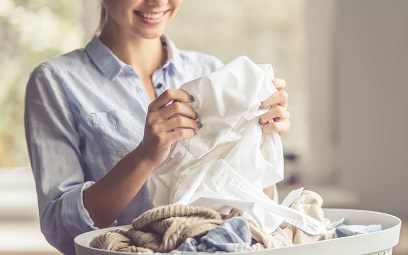 woman folding washing